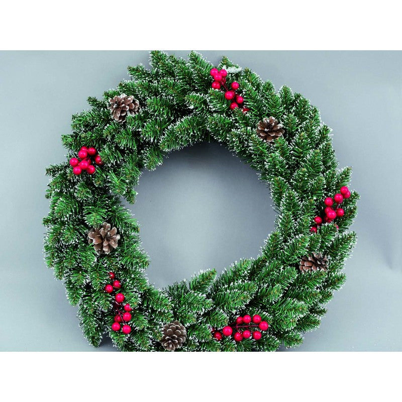 Green Christmas wreath behind the door with pine cones 50 cm