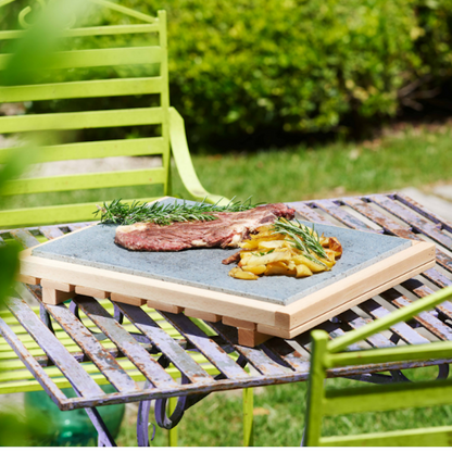 Wooden cutting board with lava stone for cooking