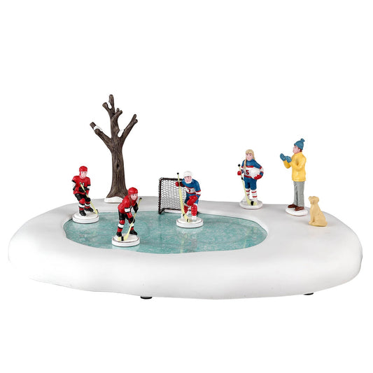 Figura de niñas jugando hockey para aldea navideña