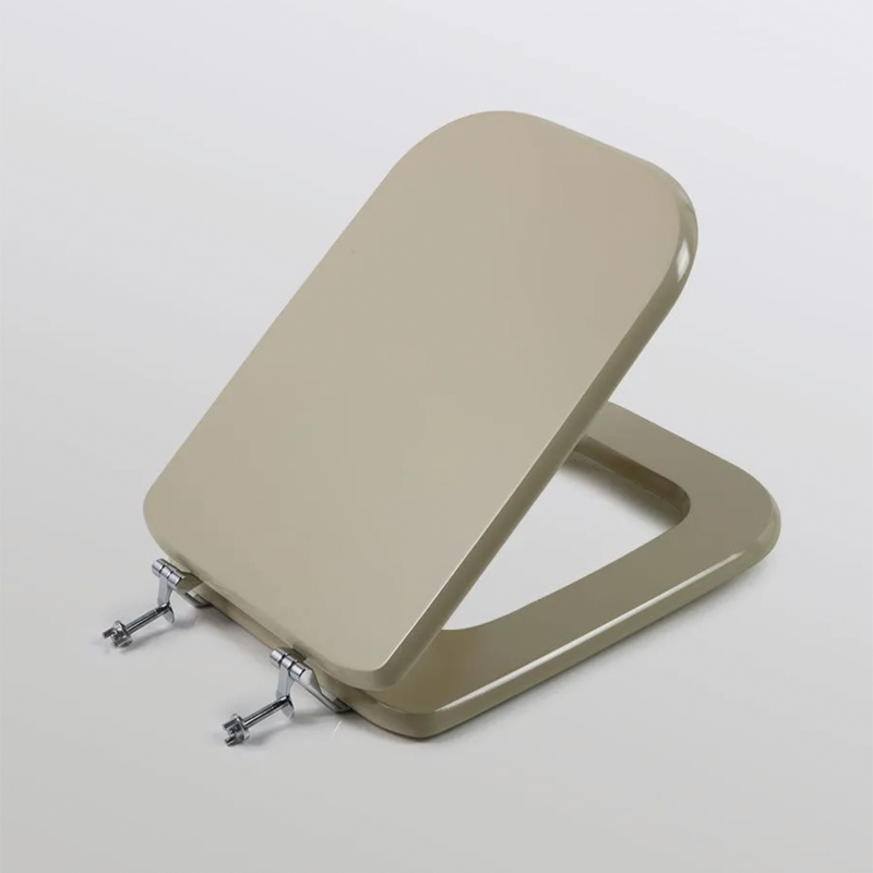 Champagne colored toilet seat with universal hinges